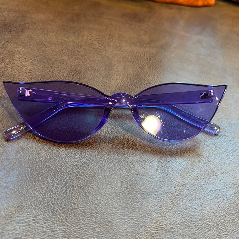 One size fits all. Purple sunglasses.